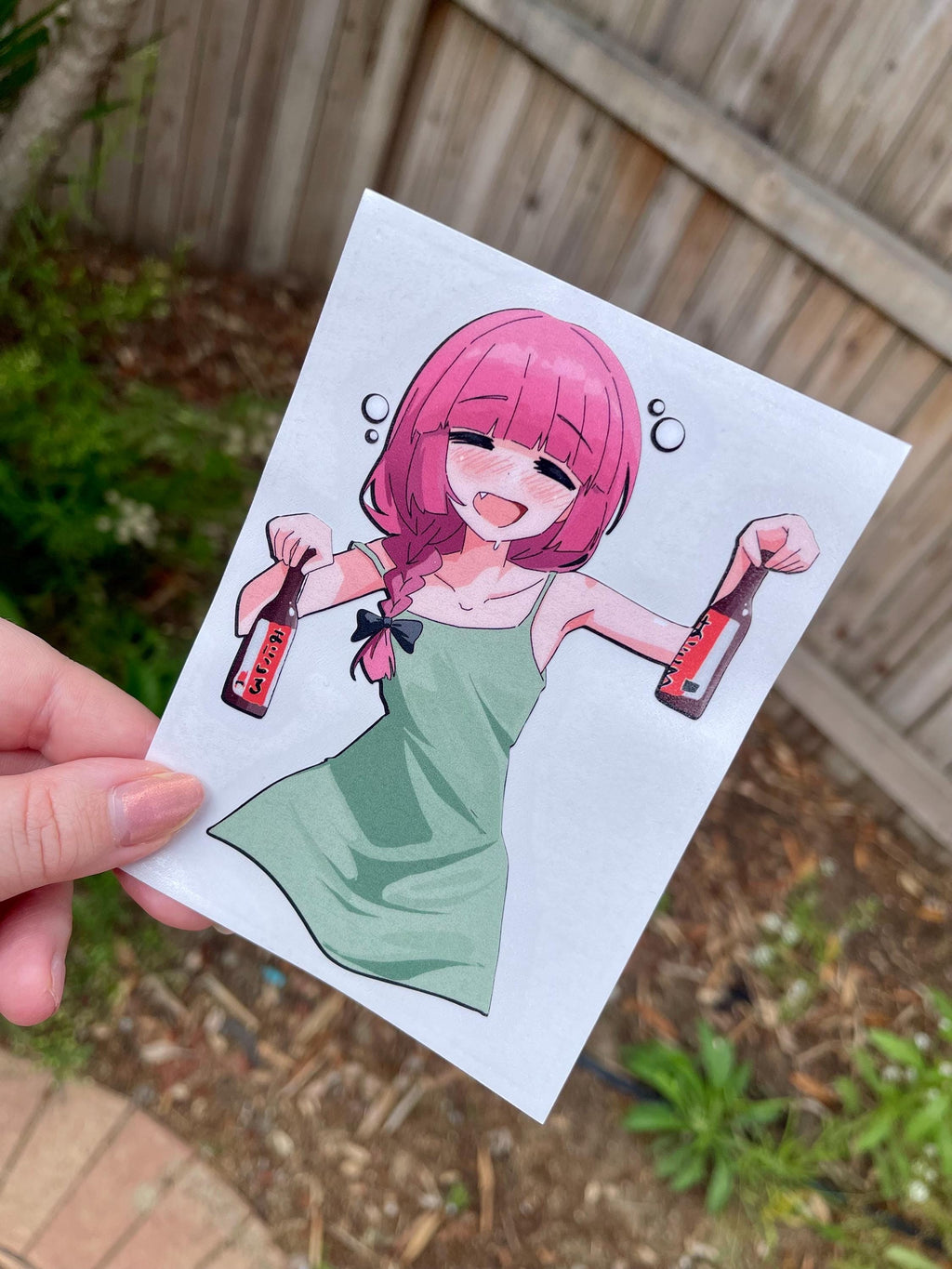 funny drunk anime girl sticker of Kikuri from Bocchi the rock with pink hair and a green dress holding beer bottles.